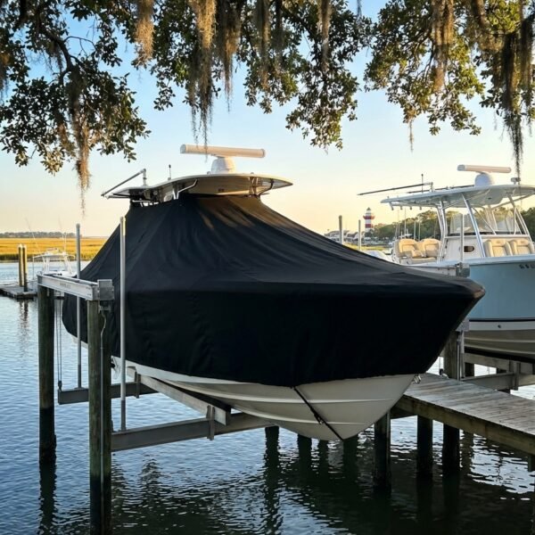 EdgeWater 265 T-Top boat cover in black Sunbrella fabric on dock lift at Hilton Head South Carolina marina