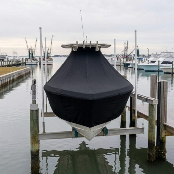 NauticStar 244 XTS T-Top boat cover in Black Sunbrella fabric on dock lift at Gulfport, MS
