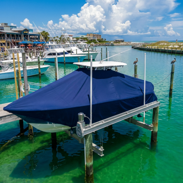 Sailfish 275 DC T-Top boat cover in navy Sunbrella fabric on dock lift at Destin Florida