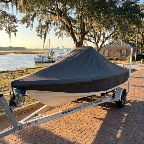 Scout 210 XSF center console boat cover in charcoal Sunbrella fabric on trailer at Savannah Georgia marina
