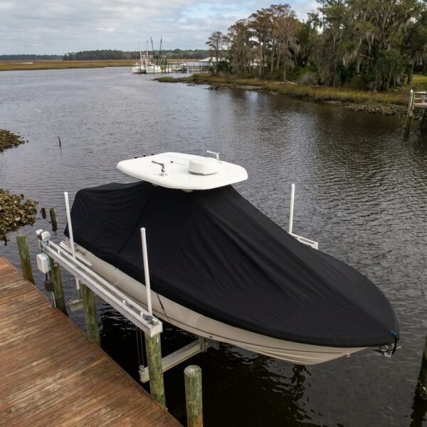 Scout 220 Bay T-Top boat cover in black Sunbrella fabric on dock lift at Georgetown South Carolina