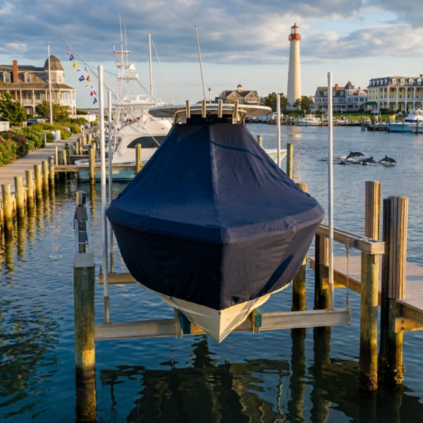 Scout 345 T-Top boat cover in navy Sunbrella fabric on dock lift at Cape May New Jersey