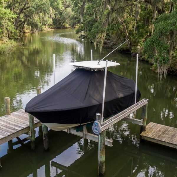 Sea Pro 210 T-Top boat cover in Black Sunbrella fabric on dock lift at Edisto Island, SC creek