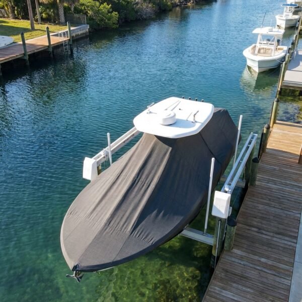 Sea Pro 248 T-Top boat cover in Charcoal Sunbrella fabric on dock lift at Wrightsville Beach, NC