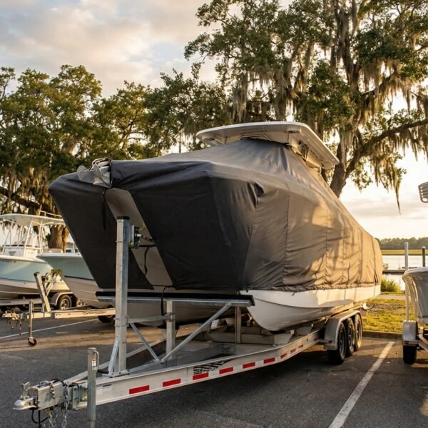 World Cat 230 DC catamaran boat cover in charcoal Sunbrella fabric on trailer at Wrightsville Beach North Carolina marina