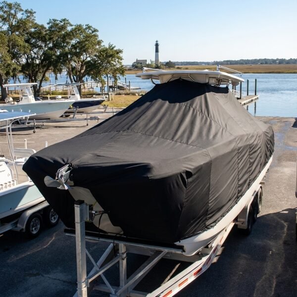 World Cat 260 CC-X catamaran boat cover in black Sunbrella fabric on trailer at Southport North Carolina waterway
