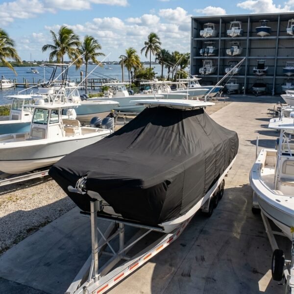 World Cat 325 CC catamaran boat cover in black Sunbrella fabric on trailer at Stuart Florida marina