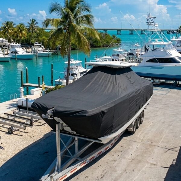 World Cat 400 CC-X catamaran boat cover in charcoal Sunbrella fabric on trailer at Islamorada Florida Keys marina