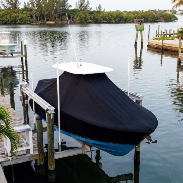 Blackfin 252 T-Top boat cover in Black Sunbrella fabric on canal lift at Jensen Beach, FL