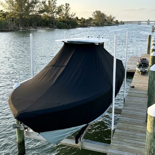 Pathfinder 2005 TRS T-Top boat cover in Black Sunbrella fabric on dock lift at Sebastian Inlet, Florida