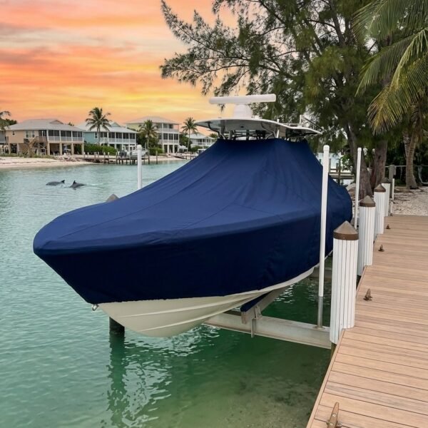 Pathfinder 2400 TRS T-Top boat cover in Navy Sunbrella fabric on dock lift at Sanibel Island, Florida