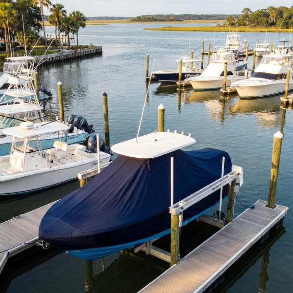 Sea Fox 186 Commander T-Top boat cover in Navy Sunbrella fabric on canal lift at Skull Creek Marina, Hilton Head, SC