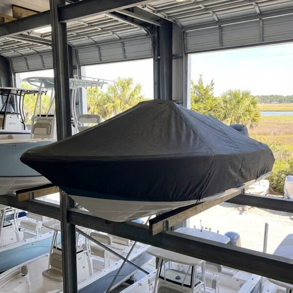Sea Fox 195 Bay Fisher center console boat cover in Charcoal Sunbrella fabric on storage rack at James Island, SC