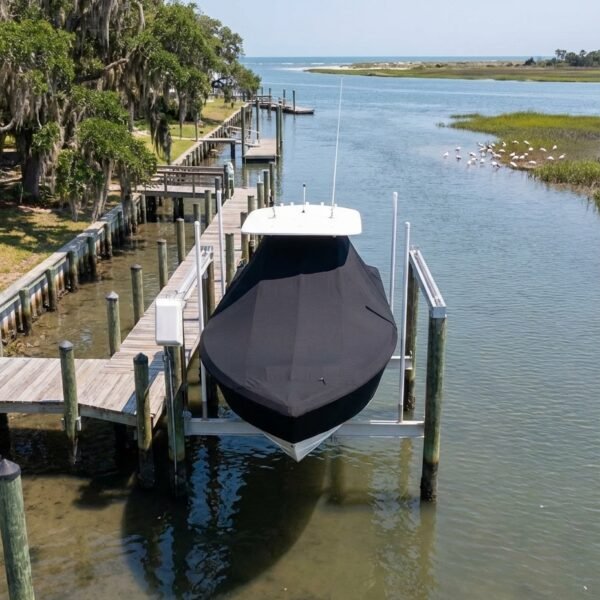 Sea Fox 246 Commander T-Top boat cover in Black Sunbrella fabric on dock lift at Lazaretto Creek Marina, Tybee Island, GA