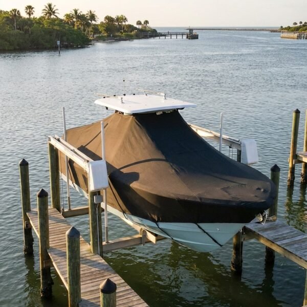 Sea Fox 286 T-Top boat cover in Charcoal Sunbrella fabric on dock lift at Sebastian Inlet Marina, Sebastian, FL