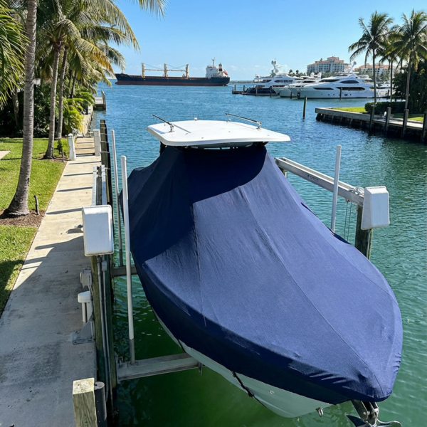 Sea Vee 270 Z T-Top boat cover in navy Sunbrella fabric on dock lift at Government Cut, Miami FL
