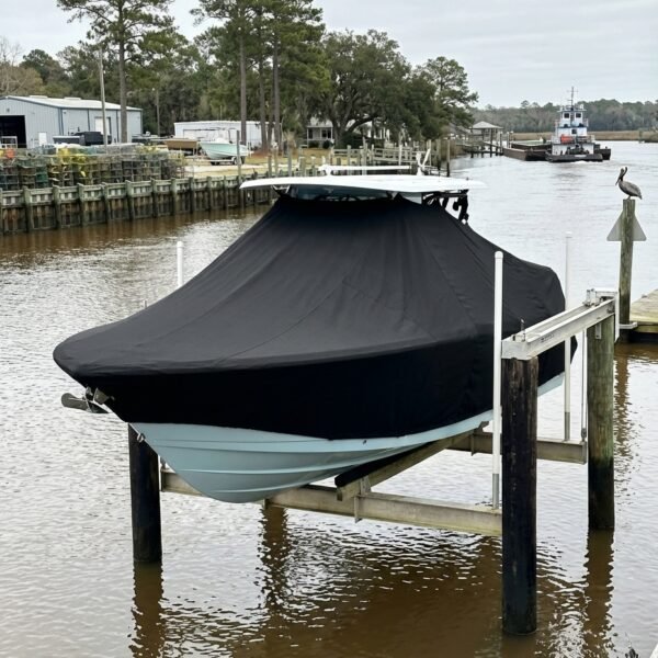 Tidewater 1900 SV T-Top boat cover in Black Sunbrella fabric on dock lift at Georgetown, South Carolina