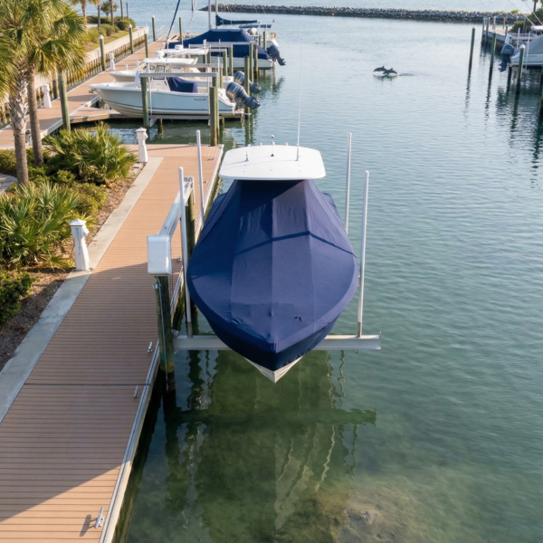 Tidewater 1900 T-Top boat cover in Navy Sunbrella fabric on dock lift at Hilton Head Island, South Carolina
