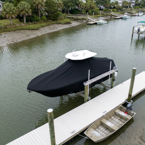 Tidewater 2110 BayMax T-Top boat cover in Black Sunbrella fabric on dock lift at Isle of Palms, South Carolina