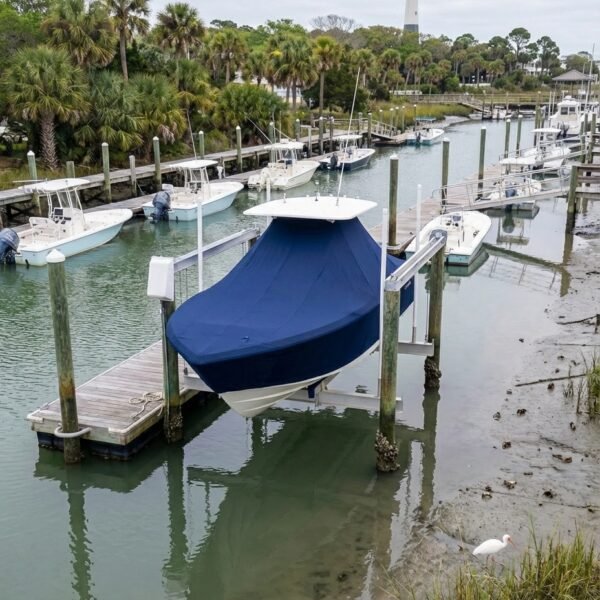 Tidewater 2300 Bay T-Top boat cover in Navy Sunbrella fabric on dock lift